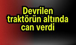 Devrilen traktörün altında can verdi